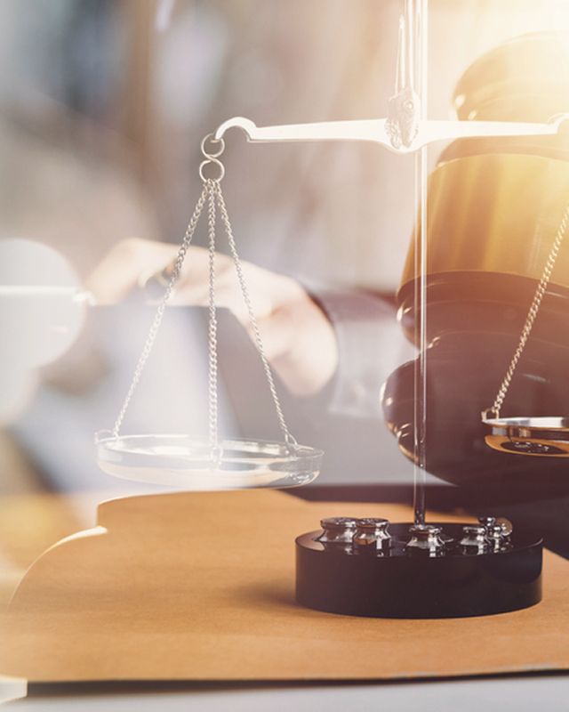 Scales of justice beside a gavel